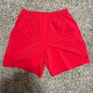 Lululemon athletic shorts. More pink than red.